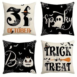 Set of four Halloween linen pillow covers with spooky festive patterns and typography