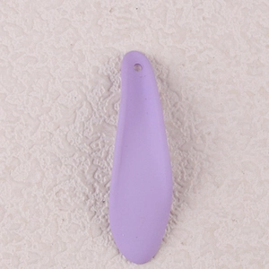 Detail of purple acrylic petal-shaped earring pendant with a hanging hole design