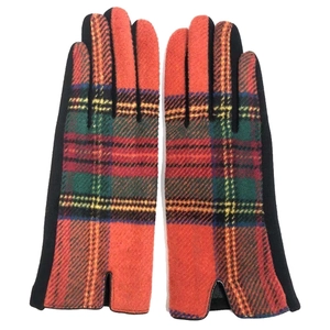 Detail of red and green tartan wool gloves with black palm fabric for winter warmth