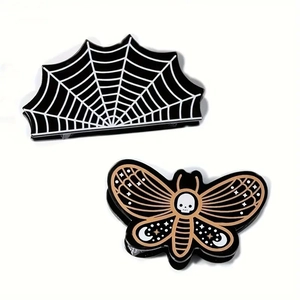 Gothic Halloween hair claw set with spider web and skull moth designs in dark acrylic finish
