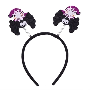 Halloween headband with spring-loaded spider decorations in black, purple, and white colors