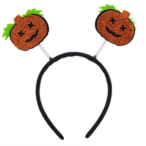 Close-up of Halloween headband with orange glitter pumpkins on spring coils