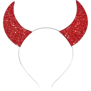 Close-up of red sequined devil horns on a silver metal headband for Halloween party