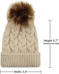Detail view of beige knit beanie with pom-pom showing 6.7 inch height and 5.9 inch width