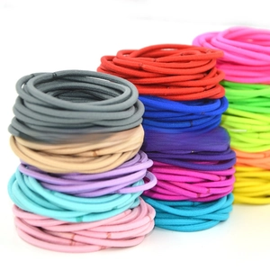 Close-up of seamless high-elastic hair ties in various vibrant candy colors stacked vertically