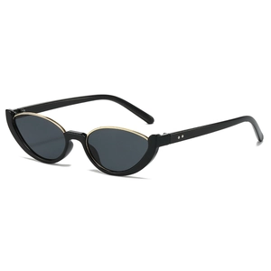 Occhiali da sole ovali cat eye neri con eleganti dettagli in metallo dorato