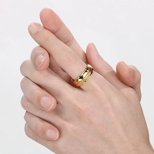 Minimalist hammered texture gold titanium steel ring shown on a hand model