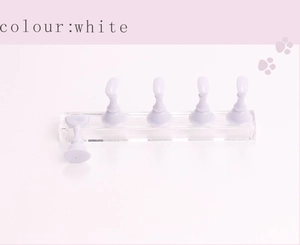 Detailed view of long acrylic nail practice stand with five white display chess holders
