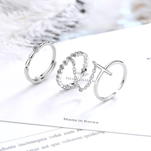 Three-piece silver ring set with cross design, chain detail and small crystals for women