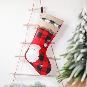 Plaid Christmas stocking featuring Santa Claus applique on a rustic wooden ladder