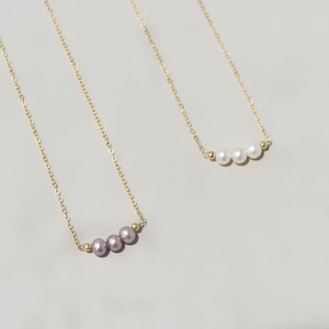 Minimalist 14K gold filled necklace with three natural freshwater pearls on a delicate chain