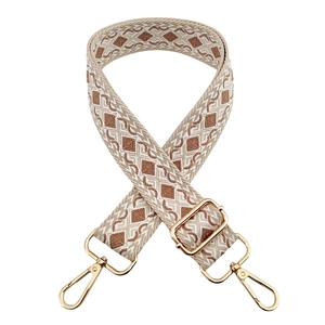 Detail of colorful jacquard diamond pattern strap with golden metal lobster clasps