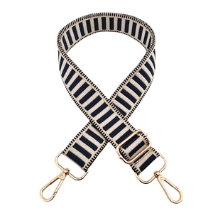 Adjustable black and white striped bag strap with premium gold metal clasps and hardware
