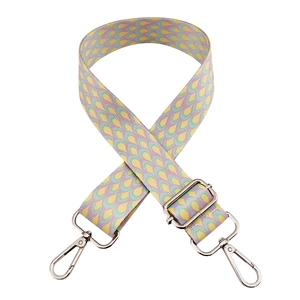 Detail of adjustable 3.8cm bohemian canvas bag strap with colorful weave and silver hooks