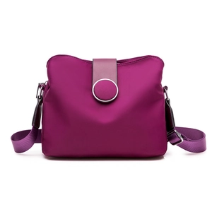 Minimalist purple nylon crossbody bag with multi-layer storage and silver metal buckle