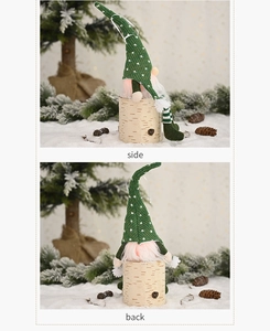 Detail view of the side and back of a Christmas gnome decoration with a green knit hat