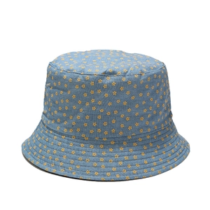 Blue denim bucket hat for women with yellow floral print and reversible sun protection design