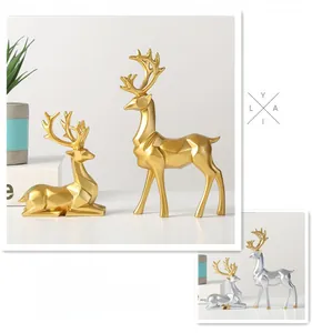 Detail of geometric resin deer statues with polished gold and silver electroplated finish