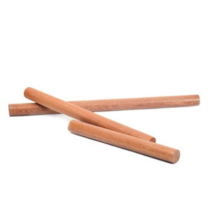 Three ebony wood rolling pins for baking shown on white background with natural grain