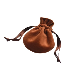 Single brown velvet drawstring jewelry pouch for gift packaging on white background