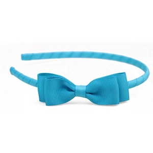 Close-up of sky blue ribbed grosgrain ribbon bow headband with detailed fabric texture