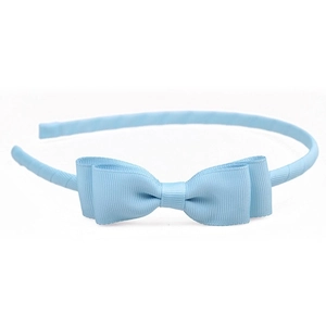 Detailed view of light blue grosgrain ribbon headband featuring a double layered bow