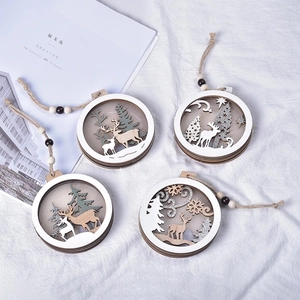 Set of 4 laser-cut wooden Christmas ornaments featuring reindeer and forest designs