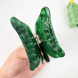Cute green butterfly hair claw clip with stylish resin texture for Christmas hairstyles