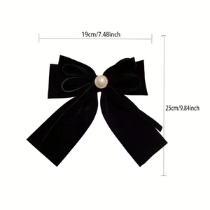 Large black velvet bow hair clip with pearl center decoration and elegant long ribbons
