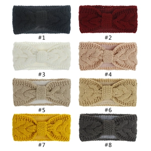 Eight colors of knit winter headbands featuring warm fleece lining and a bow knot design