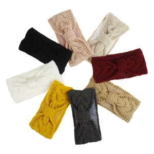 Detail of 8-pack cable knit winter headbands with warm fleece lining and twist design