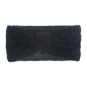 Detail of black knitted headband featuring classic twist weave and fleece lining texture