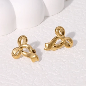 Elegant 18K gold plated stainless steel bow earrings on a minimalist white background