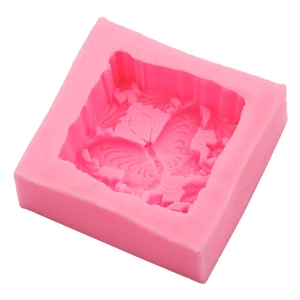 Pink silicone mold for DIY soap making featuring detailed butterfly and flower relief patterns