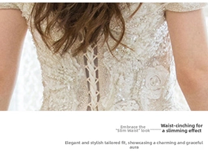 Close-up of lace wedding dress back featuring intricate floral embroidery and corset lacing
