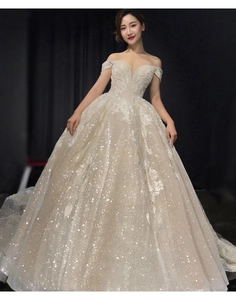 Exquisite sequined fabric detail and floral lace embroidery on off-shoulder bridal gown