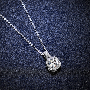 Macro detail of S925 sterling silver square halo pendant with 1 carat moissanite stone