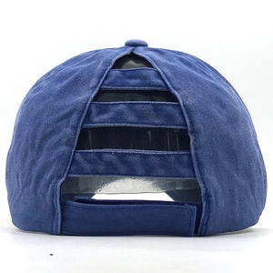 Detail of navy washed cotton ponytail baseball cap with criss-cross elastic bands
