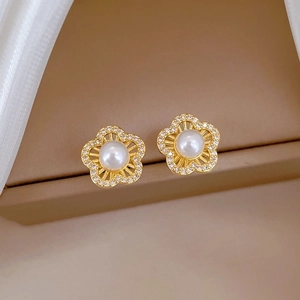 Elegant gold titanium flower earrings with white pearls and sparkling pavé crystals
