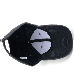 Internal view of grey knit baseball cap showing black lining and 100% acrylic fabric label
