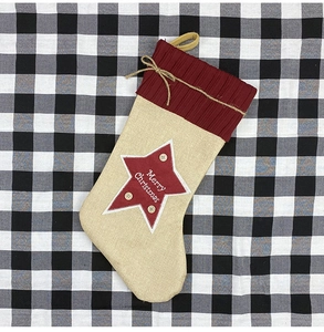 Linen Christmas stocking with red knit cuff and Merry Christmas star embroidery on plaid