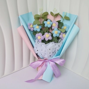 Hand-crocheted puff flower bouquet in blue and purple wrap with 'Just for you' ribbon