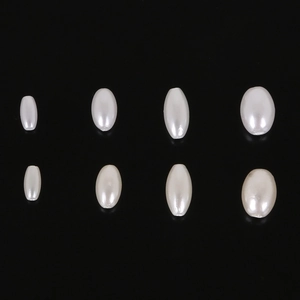Detail view of oval imitation pearls in four sizes for DIY jewelry making