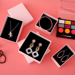 Pink minimalist jewelry box with black foam insert for necklaces and earrings