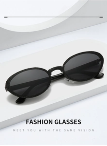 Detailed view of black oval sunglasses with textured frames and soft silicone nose pads
