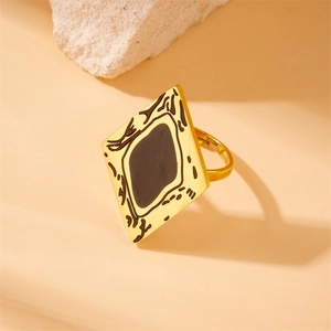 Adjustable gold-plated square ring with black enamel inlay and abstract patterns