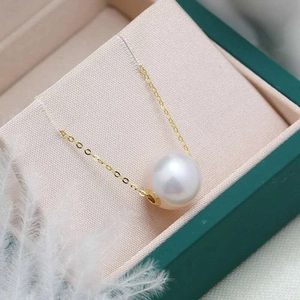 Elegant natural freshwater pearl pendant on a gold chain displayed in a gift box