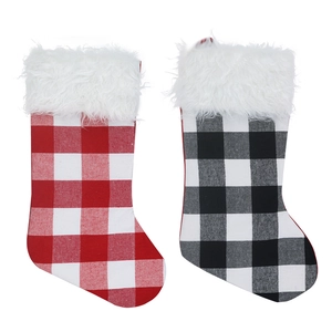 Set of large Christmas stockings with red, black, and white plaid patterns and faux fur trim