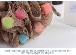 Macro detail of soft bath sponge mesh featuring colorful heart-shaped foam core balls