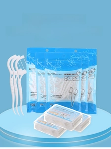 Macro shot of high-tension dental floss sticks in pouch and plastic storage box